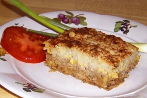 Slice of shepherd's pie and a tomato